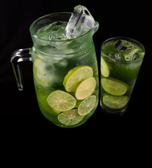 Lime juice over black background