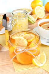 Tasty lemon jam on table close-up