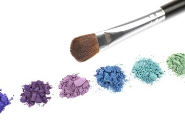 Colorful crushed eyeshadow and professional make-up brush