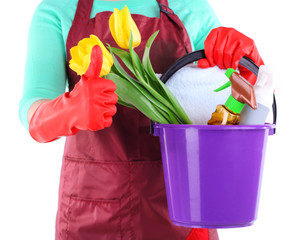 Housewife holding bucket with cleaning equipment. Conceptual