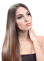 Fototapeta premium Beautiful young woman with long hair isolated on white