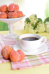 Delicious cookies peaches on table on light background