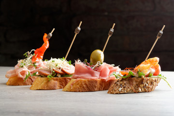 Tapas on Crusty Bread - Selection of Spanish tapas - obrazy, fototapety, plakaty