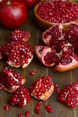 Ripe pomegranates on table close-up