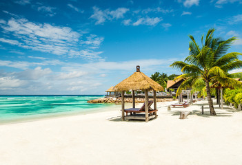 beach beds with roof and turquoise sea