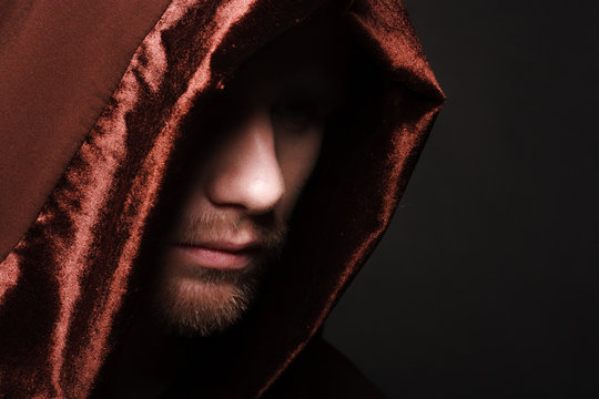 Portrait of mystery unrecognizable monk in robe