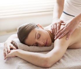 Fototapeta na wymiar Relaxing back massage at spa