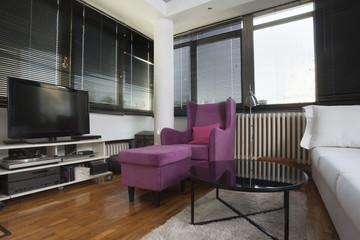 apartment with white and violet furniture