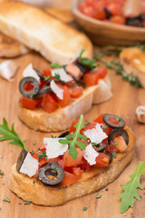 ciabatta with tomatoes, olives, parmesan cheese and herbs