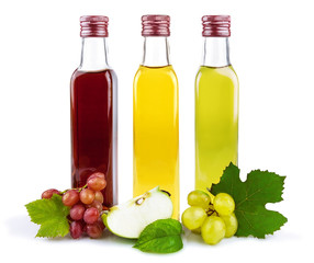 Three glass bottles of vinegar