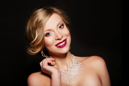 smilling woman with luxury accessories. evening makeup. hot girl
