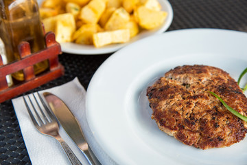 Grilled meat cutlet served