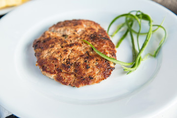 Grilled meat cutlet served