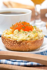 scramble eggs with red caviar and greens on a wheat bun © cook_inspire