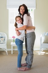 Happy mother and daughter embracing