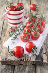 Fresh cherry tomatoes with thyme.Selective focus