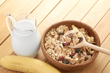 Delicious and healthy cereal in bowl with milk