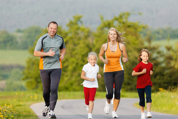 Family running for sport outdoors