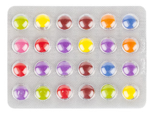 Colorful medical capsules on white background.
