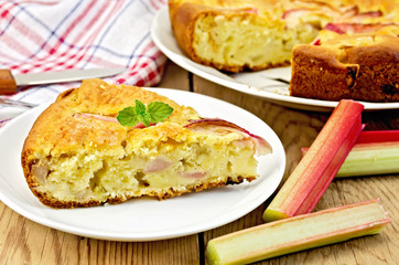 Pie with rhubarb and a knife on board