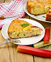 Pie with rhubarb and fork on chalkboard