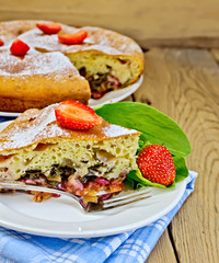 Pie with strawberry and sorrel on boards