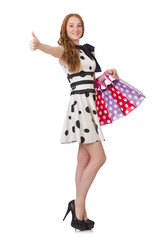 Young woman with shopping bags on white