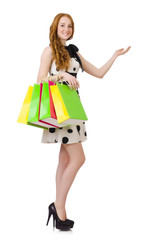 Young woman with shopping bags on white