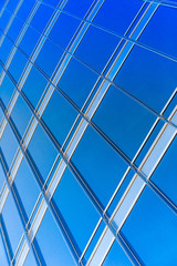 modern blue glass wall of skyscraper