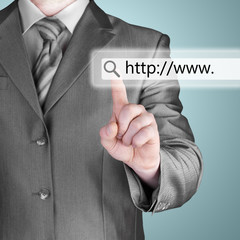 Businessman pushing virtual search bar