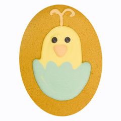 Gingerbread chick in eggshell with isolated on white