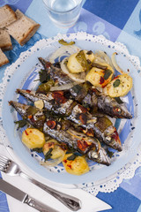 Close up view of cooked mackerel fish with potato.