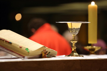 Chalice on the altar during the distribution of Holy Communion