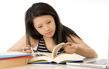 chinese asian woman studying with computer for exam