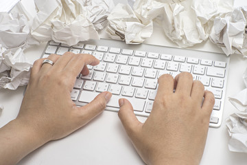 Business concept. keyboard and crumpled paper  on table.