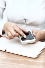 Young businesswoman working with modern devices