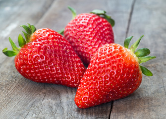 Close up of big strawberry on wood 