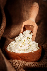 curd in brown bowl on sacking