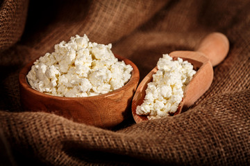 curd in brown bowl on sacking