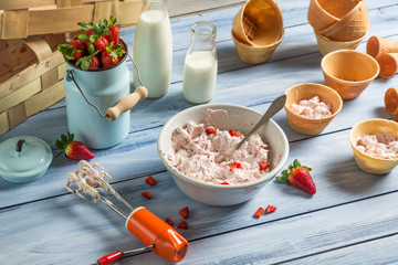 Fresh cream and strawberries as ingredients for ice cream
