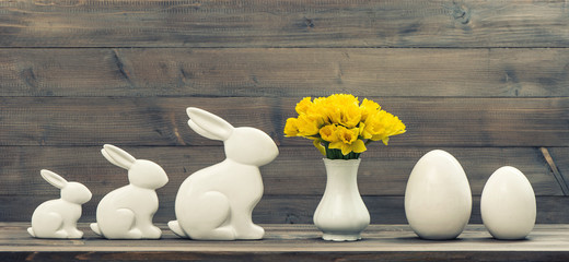 narcissus flowers with easter bunny and eggs