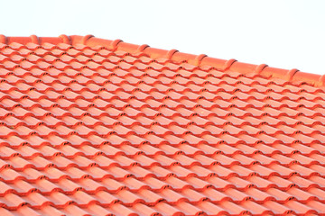 roof under construction with stacks of roof tiles for home build