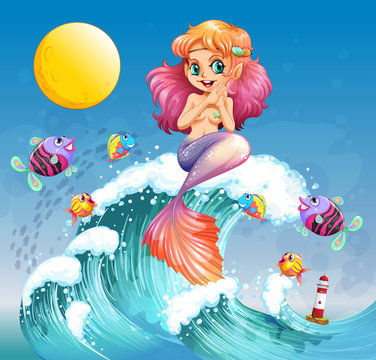 A happy mermaid above the sea waves