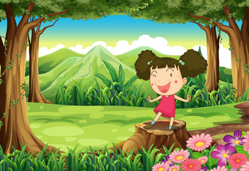Obraz na płótnie Canvas A cute little girl above the stump at the forest