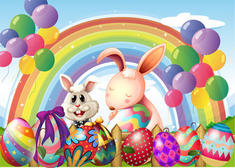 Bunnies and colorful eggs near the rainbow and floating balloons