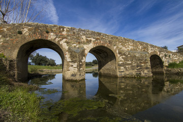 Fototapeta na wymiar View of an ancient roman bridge located in Almodovar, Portugal.