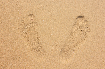 Fototapeta na wymiar Two footprints in beach