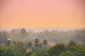 Sunset over asian town and jungle