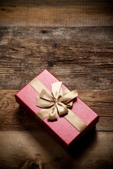 Gift box on wooden background