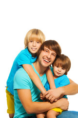 Fototapeta na wymiar Dad with two little sons